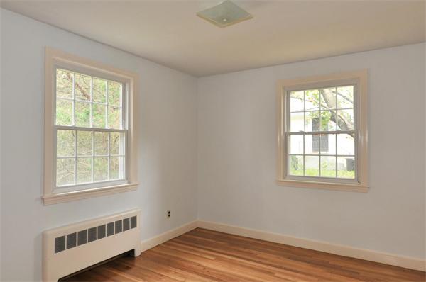 36 Arrowhead Road Concord, MA 01742 - Photo 10 of 14 a view of an empty room with wooden floor and a window