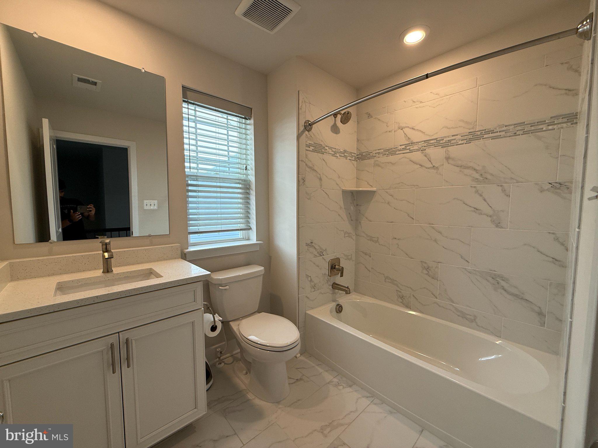 1407 Pinkerton Street Brunswick, MD 21716 - Photo 17 of 21 Modern elegance in a serene bathroom.
