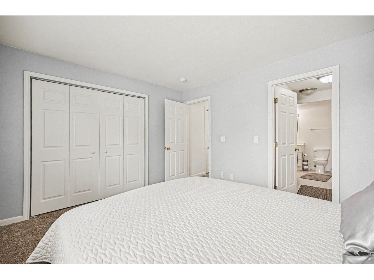 8460 Decatur Street, Unit 128 Westminster, CO 80031 - Photo 22 of 30 Primary bedroom with large closet and bathroom/laundry area connected