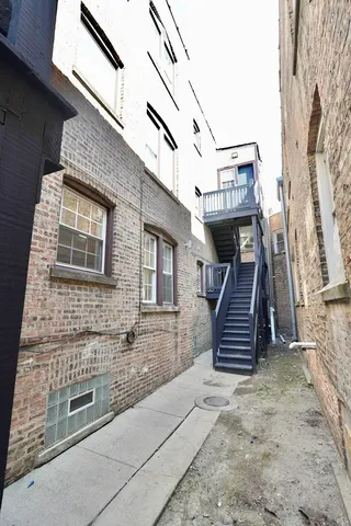 a front view of a house with stairs