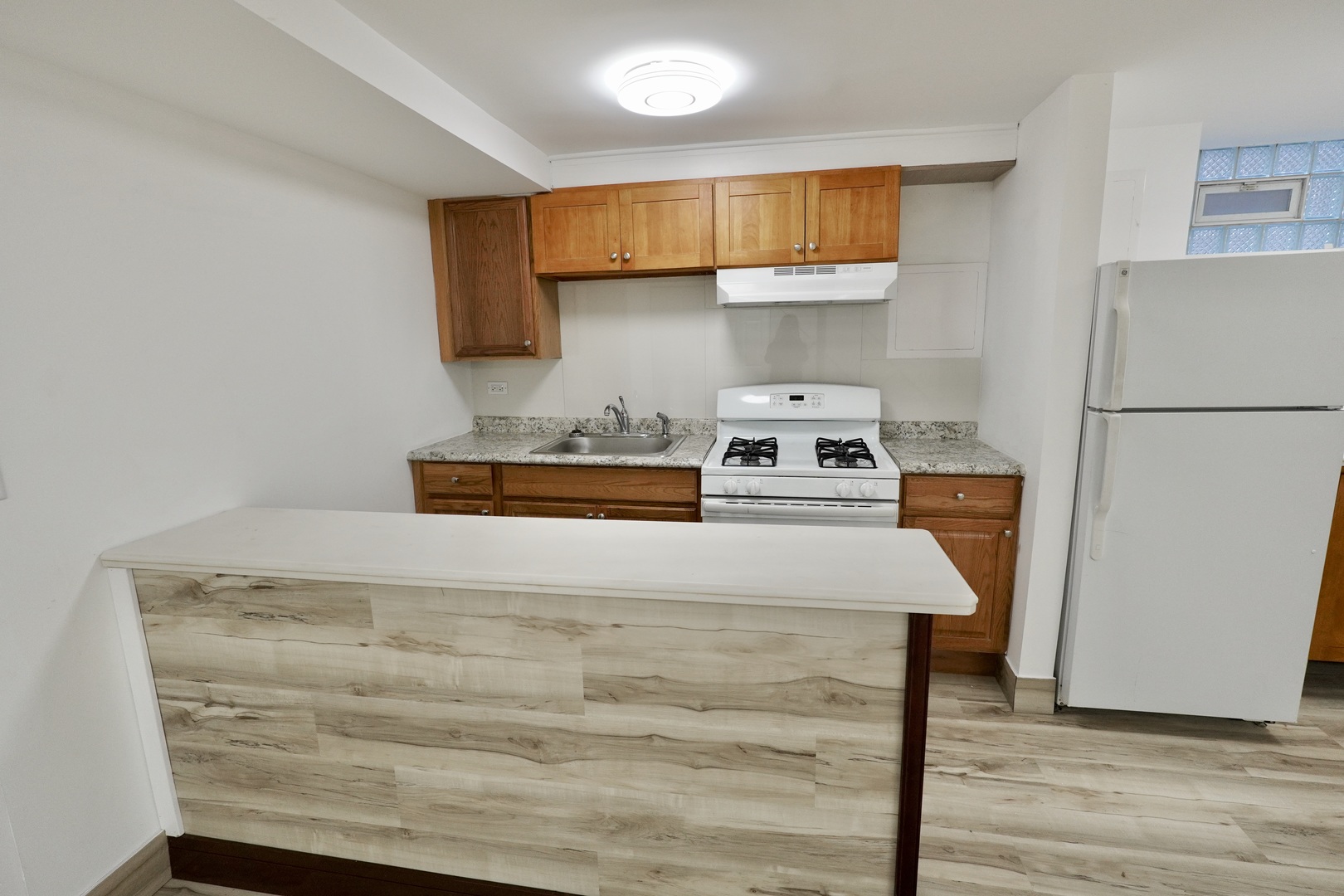 6707 South Artesian Avenue, Unit LL Chicago, IL 60629 - Photo 7 of 15 a room with a bed and a refrigerator