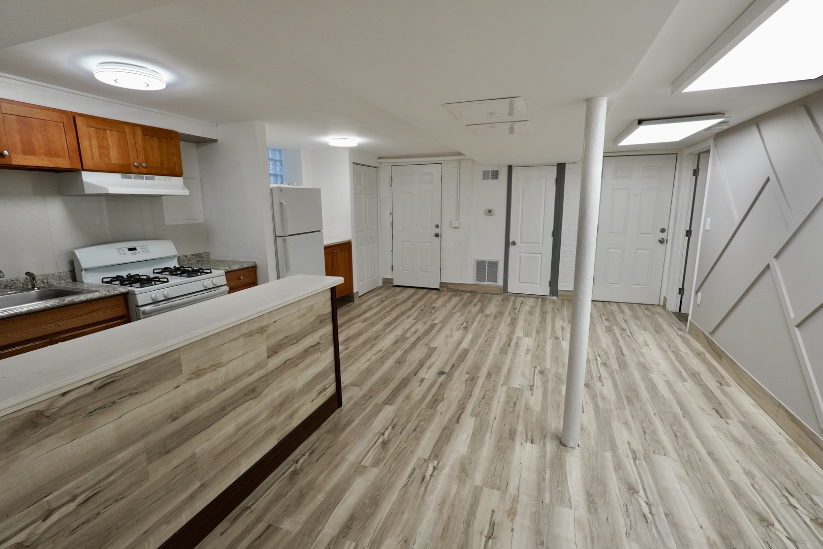 6707 South Artesian Avenue, Unit LL Chicago, IL 60629 - Photo 8 of 15 a hallway with wooden floor and cabinets