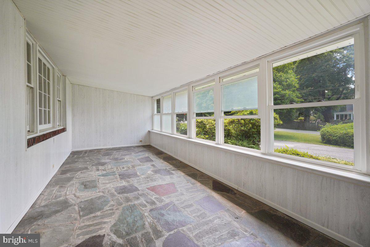 327 South Waterloo Road Devon, PA 19333 - Photo 2 of 36 Enclosed Porch 27 x 10 with Wall of Windows