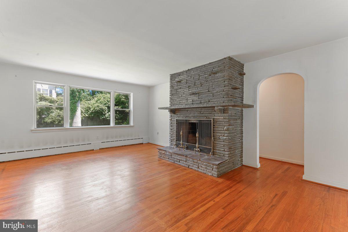 327 South Waterloo Road Devon, PA 19333 - Photo 4 of 36 Living Room with Wood Burning Fireplace