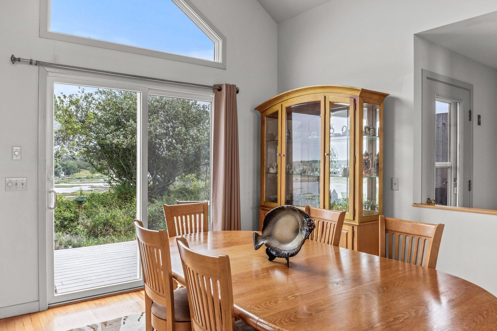 25 Great Hills Road Truro, MA 02666 - Photo 15 of 68 a view of a dining room with furniture window and wooden floor