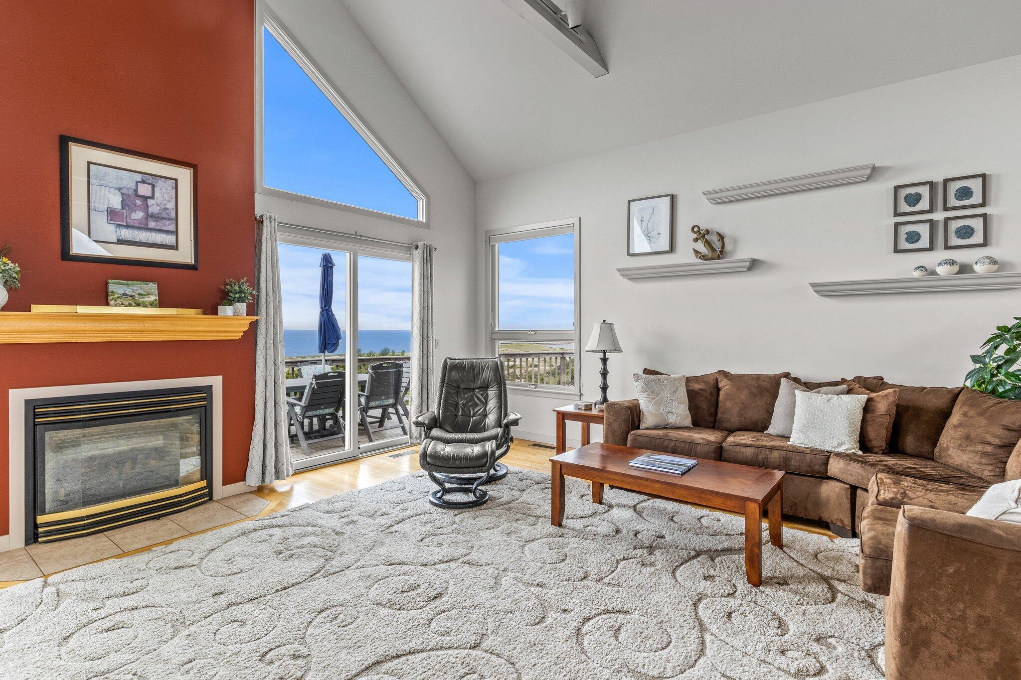 25 Great Hills Road Truro, MA 02666 - Photo 18 of 68 a living room with furniture a rug and a fireplace