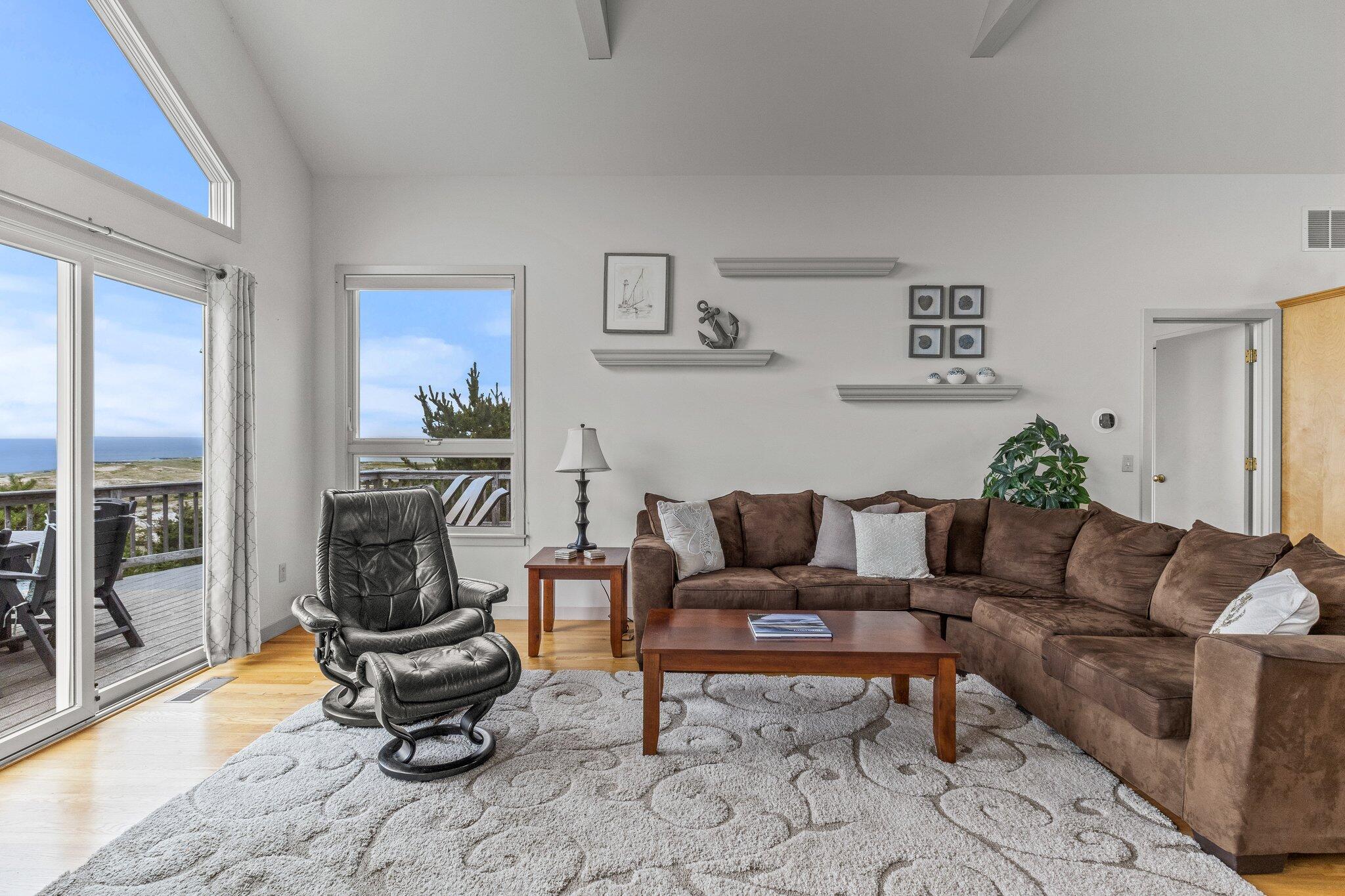 25 Great Hills Road Truro, MA 02666 - Photo 19 of 68 a living room with furniture and a gate