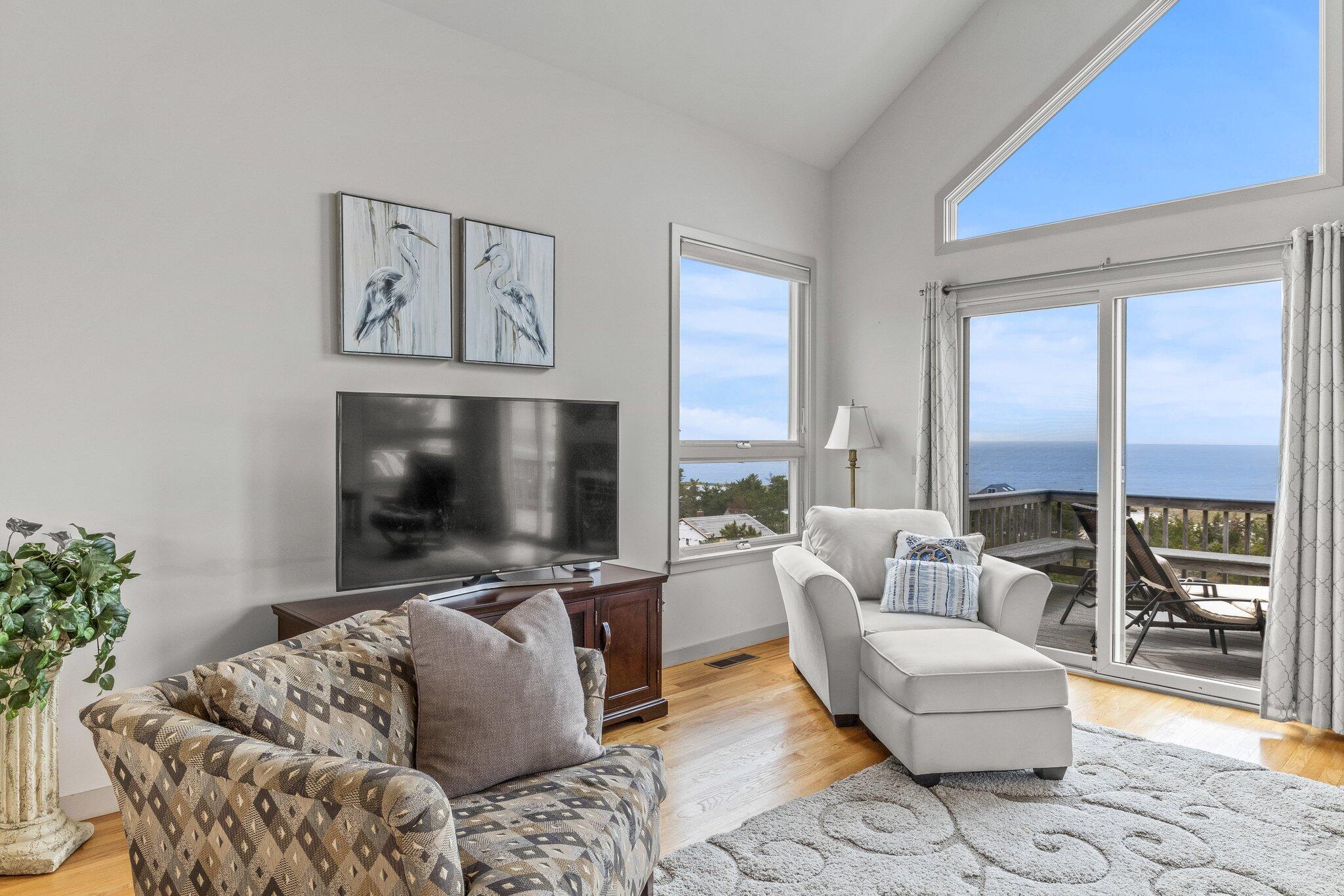 25 Great Hills Road Truro, MA 02666 - Photo 20 of 68 a living room with furniture and a flat screen tv
