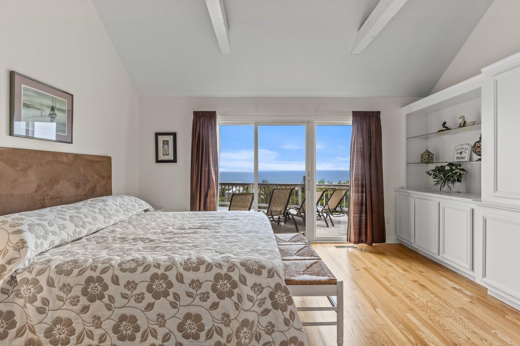 25 Great Hills Road Truro, MA 02666 - Photo 21 of 68 a bedroom with a bed and a large window