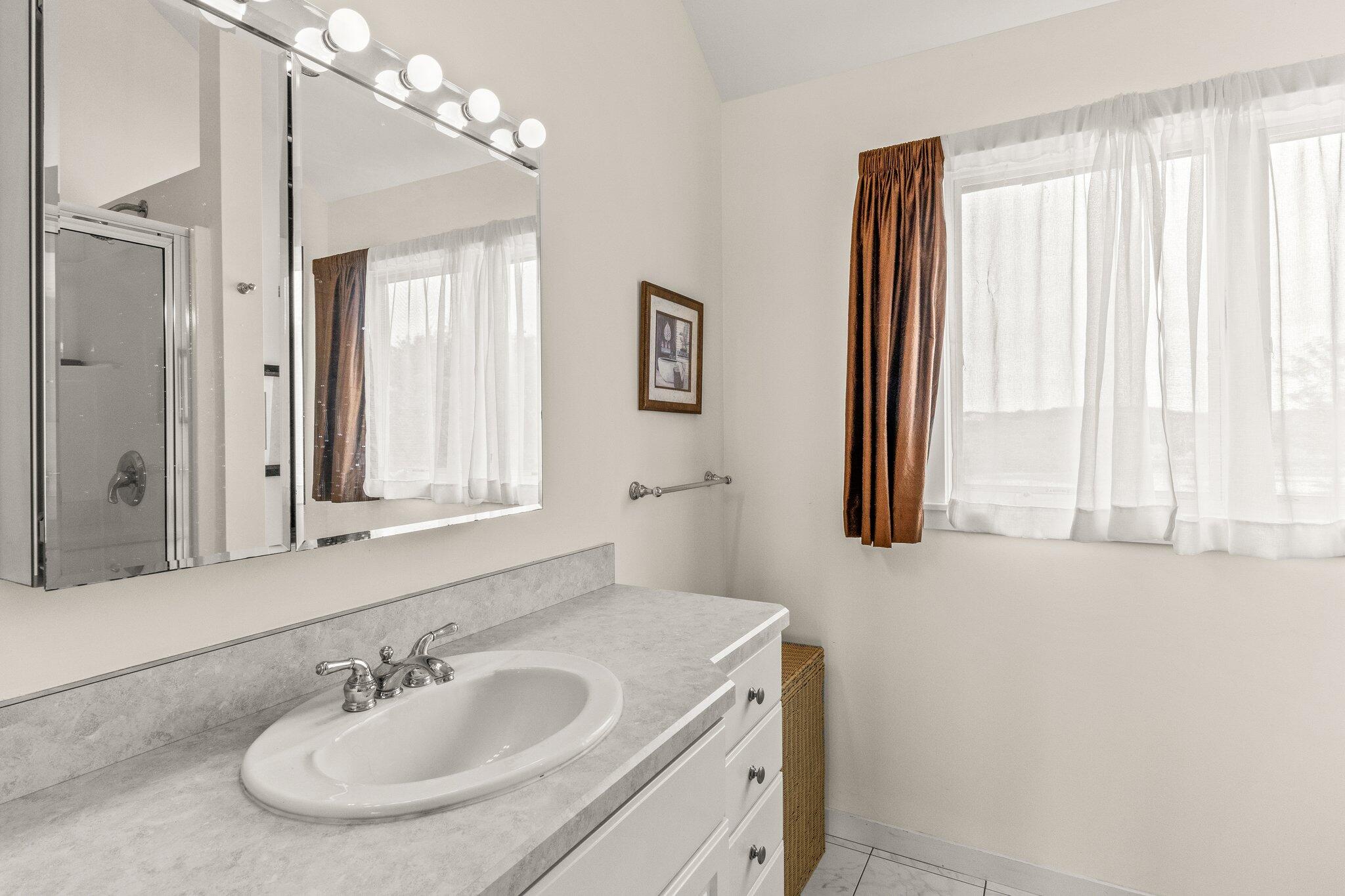 25 Great Hills Road Truro, MA 02666 - Photo 23 of 68 a bathroom with a sink and a mirror
