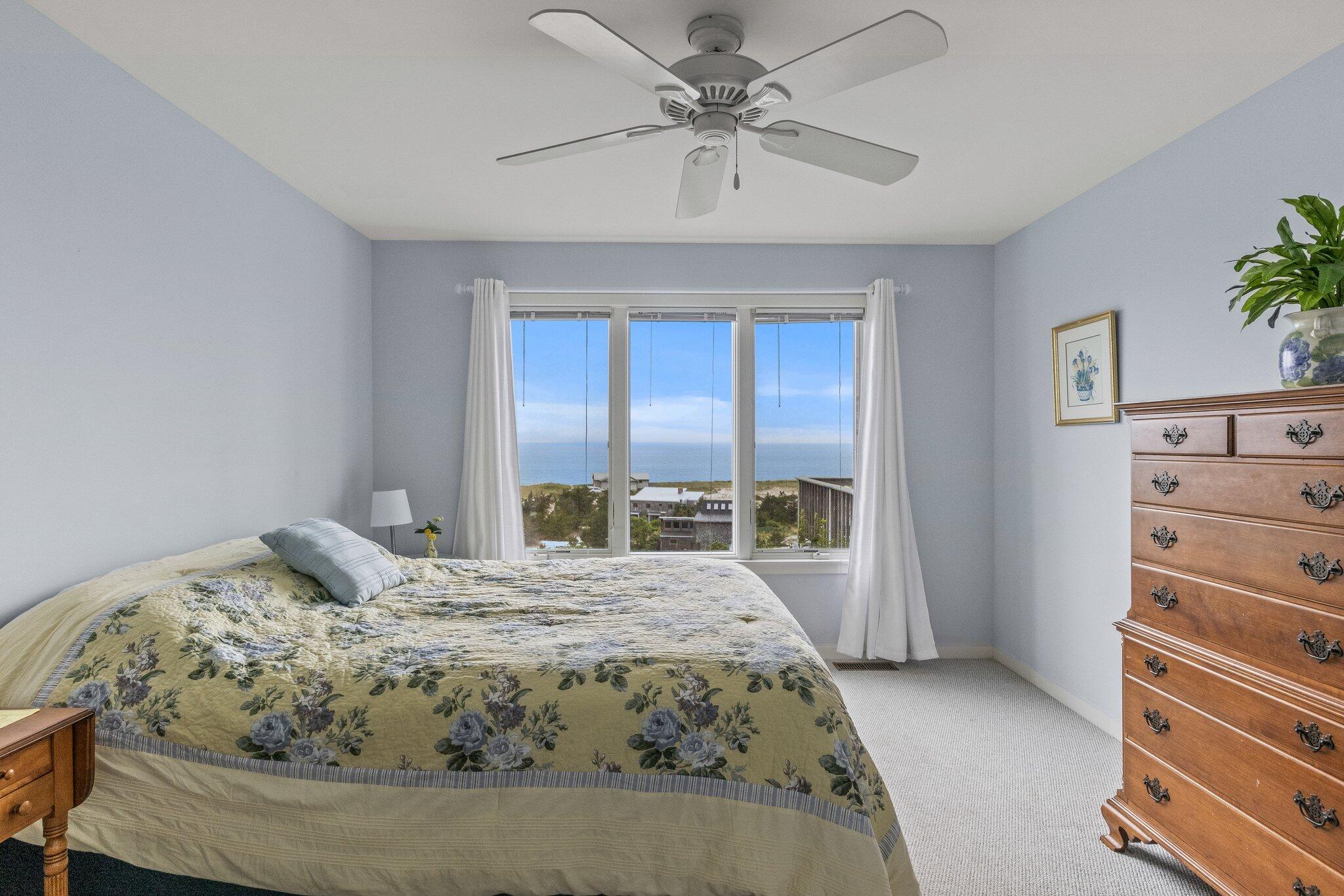 25 Great Hills Road Truro, MA 02666 - Photo 24 of 68 a bedroom with a bed and a window