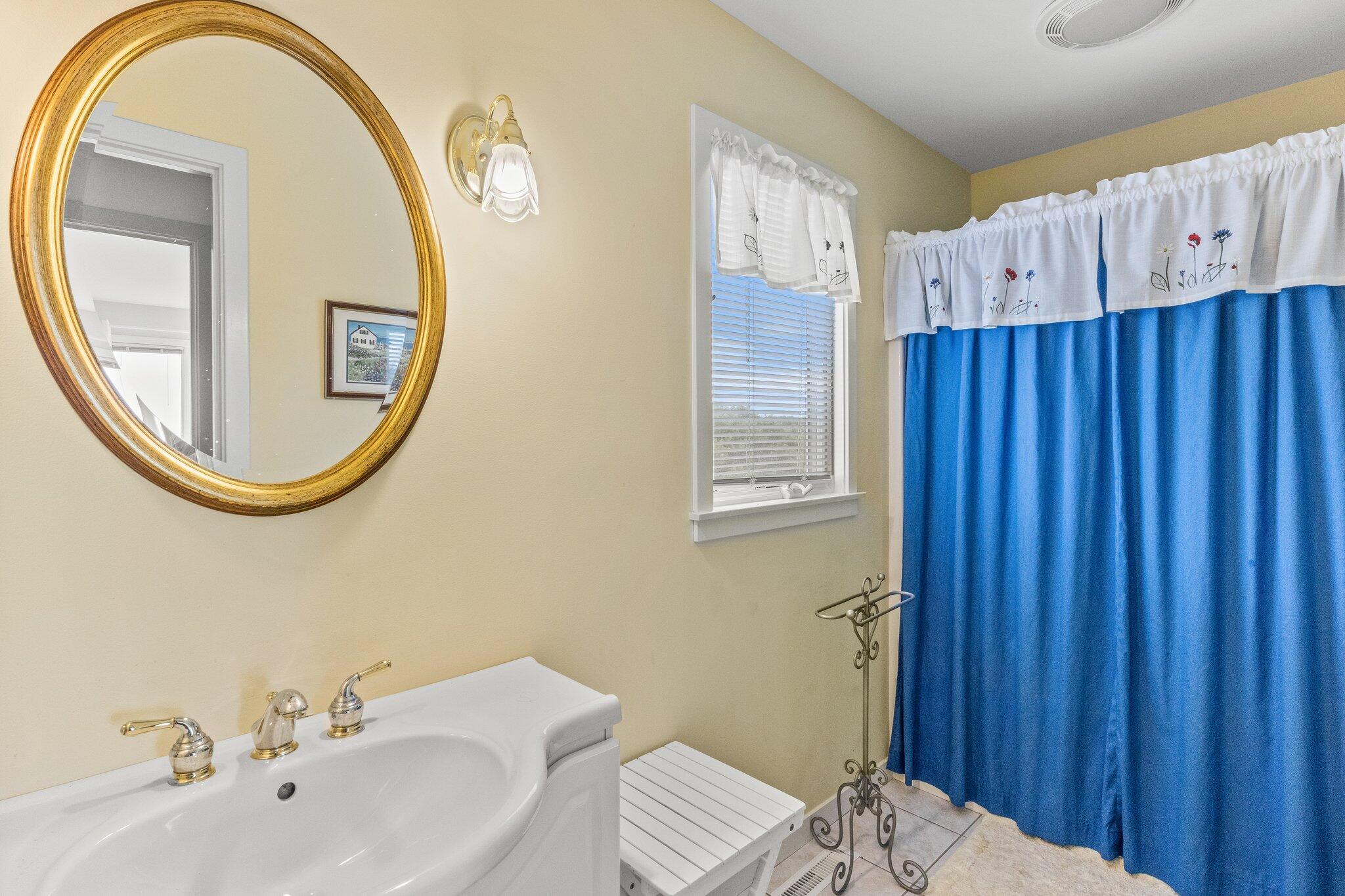 25 Great Hills Road Truro, MA 02666 - Photo 29 of 68 a bathroom with a sink and a mirror
