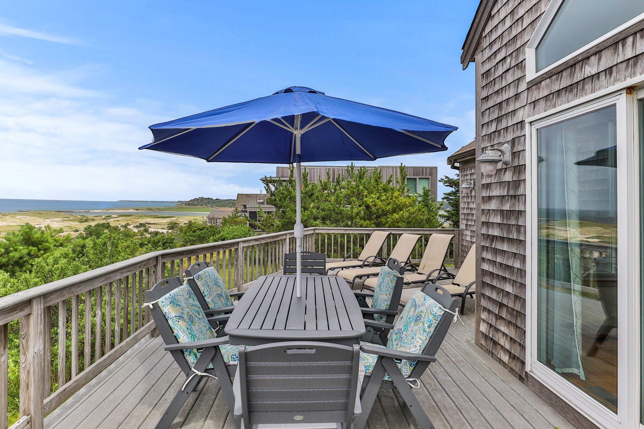 25 Great Hills Road Truro, MA 02666 - Photo 31 of 68 a view of deck with furniture and barbeque oven in the backyard