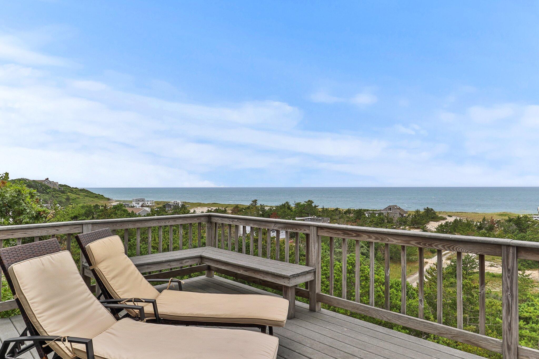 25 Great Hills Road Truro, MA 02666 - Photo 32 of 68 a view of a city from a balcony with outdoor seating