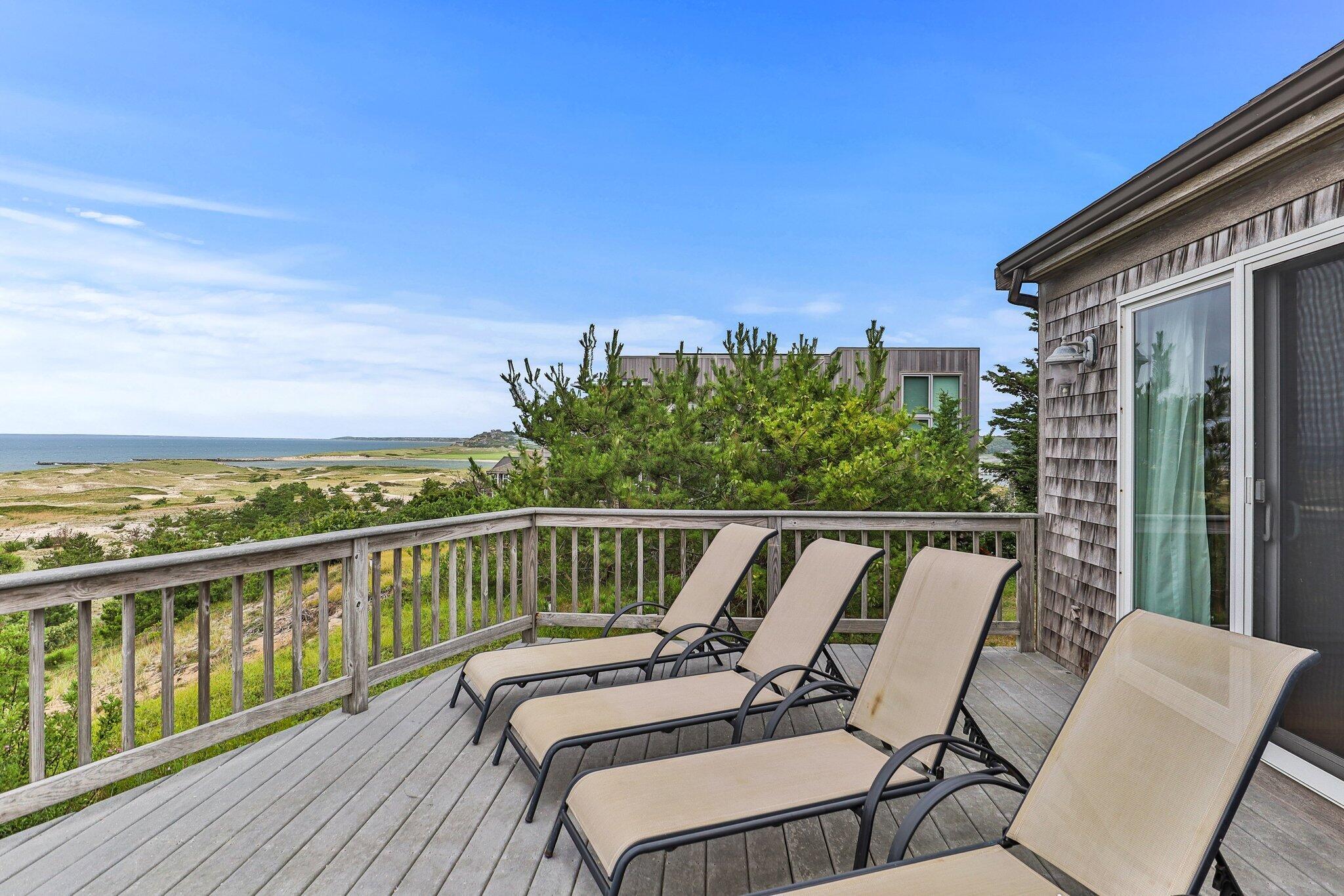 25 Great Hills Road Truro, MA 02666 - Photo 33 of 68 a view of a balcony with furniture and wooden floor