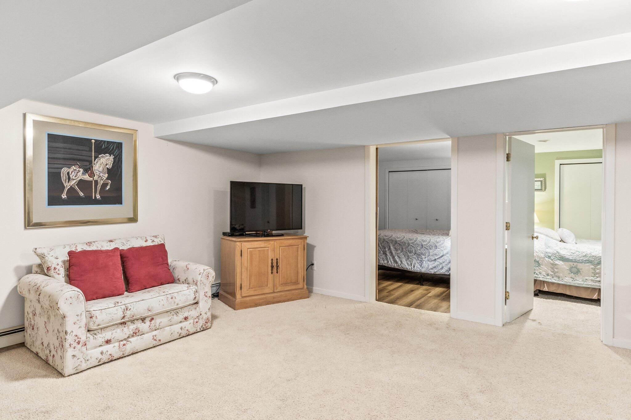 25 Great Hills Road Truro, MA 02666 - Photo 35 of 68 a bedroom with a bed and a couch