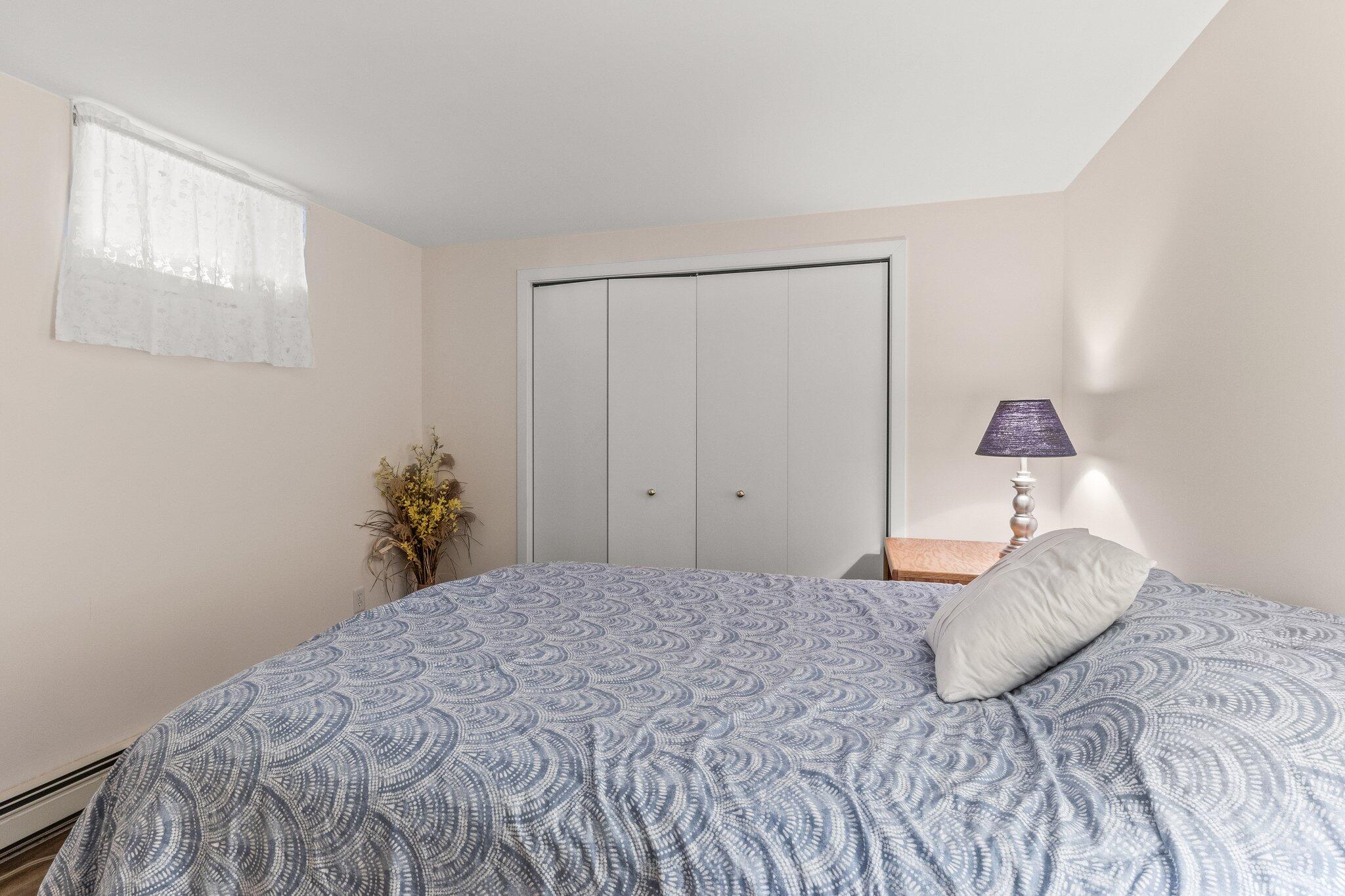 25 Great Hills Road Truro, MA 02666 - Photo 36 of 68 a bedroom with a bed and a window