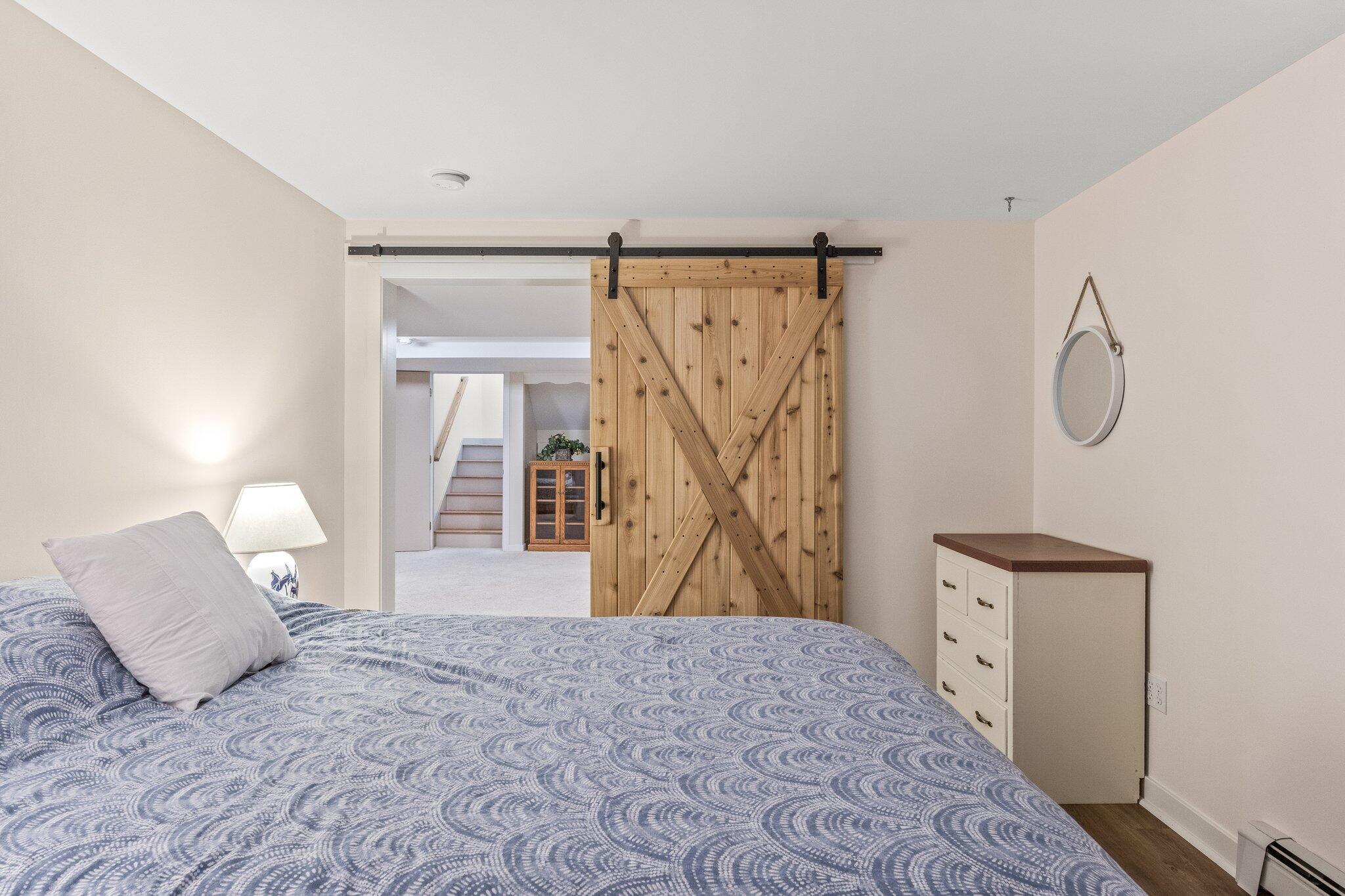 25 Great Hills Road Truro, MA 02666 - Photo 37 of 68 a bedroom with a bed and a dresser