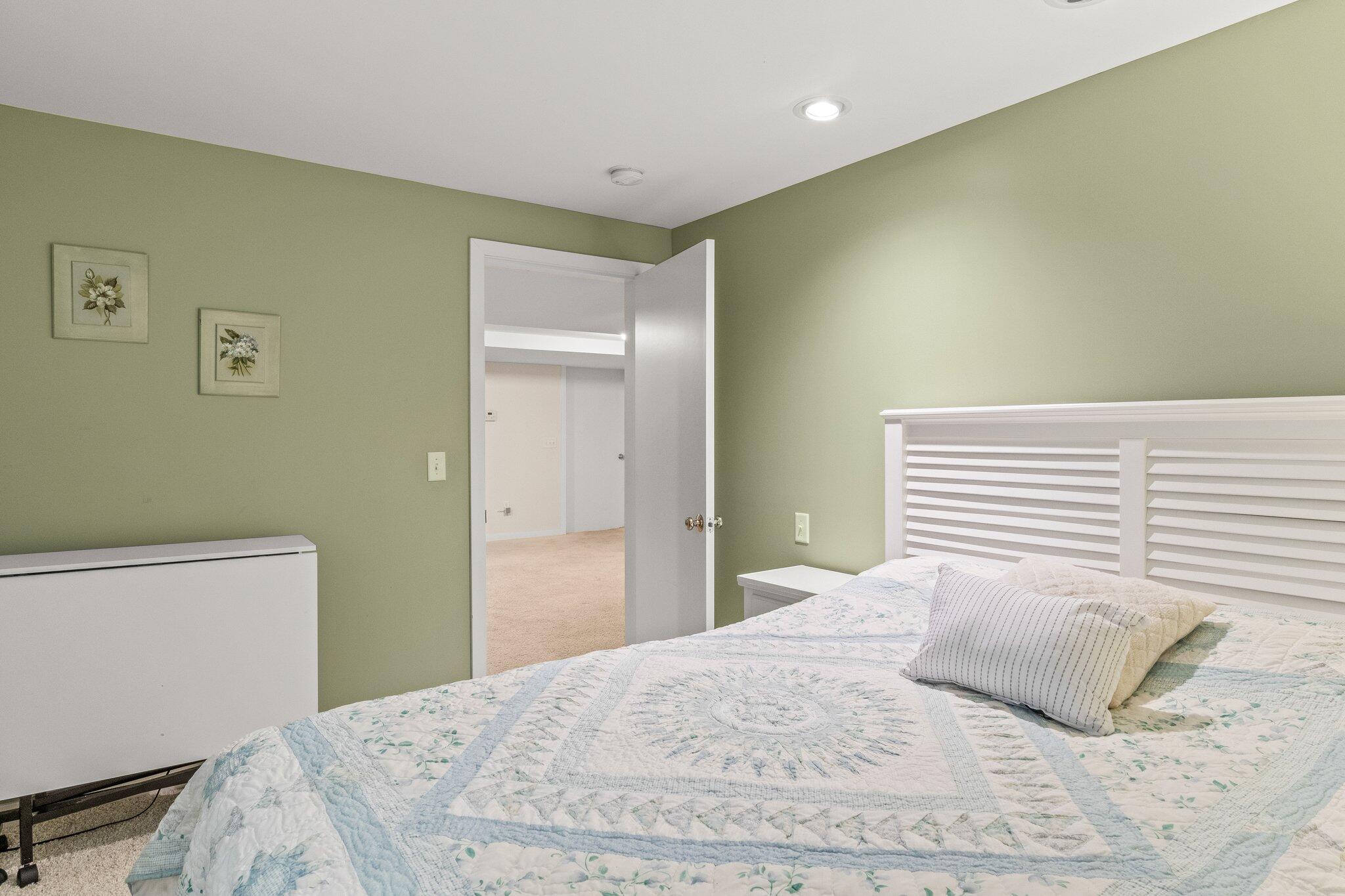 25 Great Hills Road Truro, MA 02666 - Photo 39 of 68 a bedroom with a bed and a wall painting