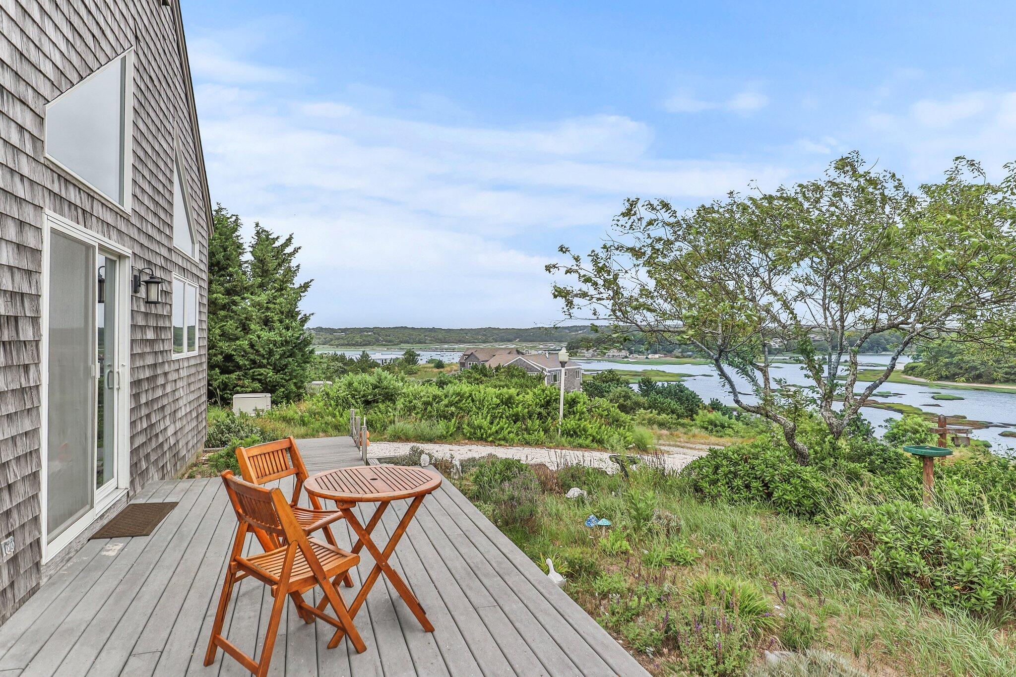 25 Great Hills Road Truro, MA 02666 - Photo 4 of 68 a view of a chairs and table on the wooden floor