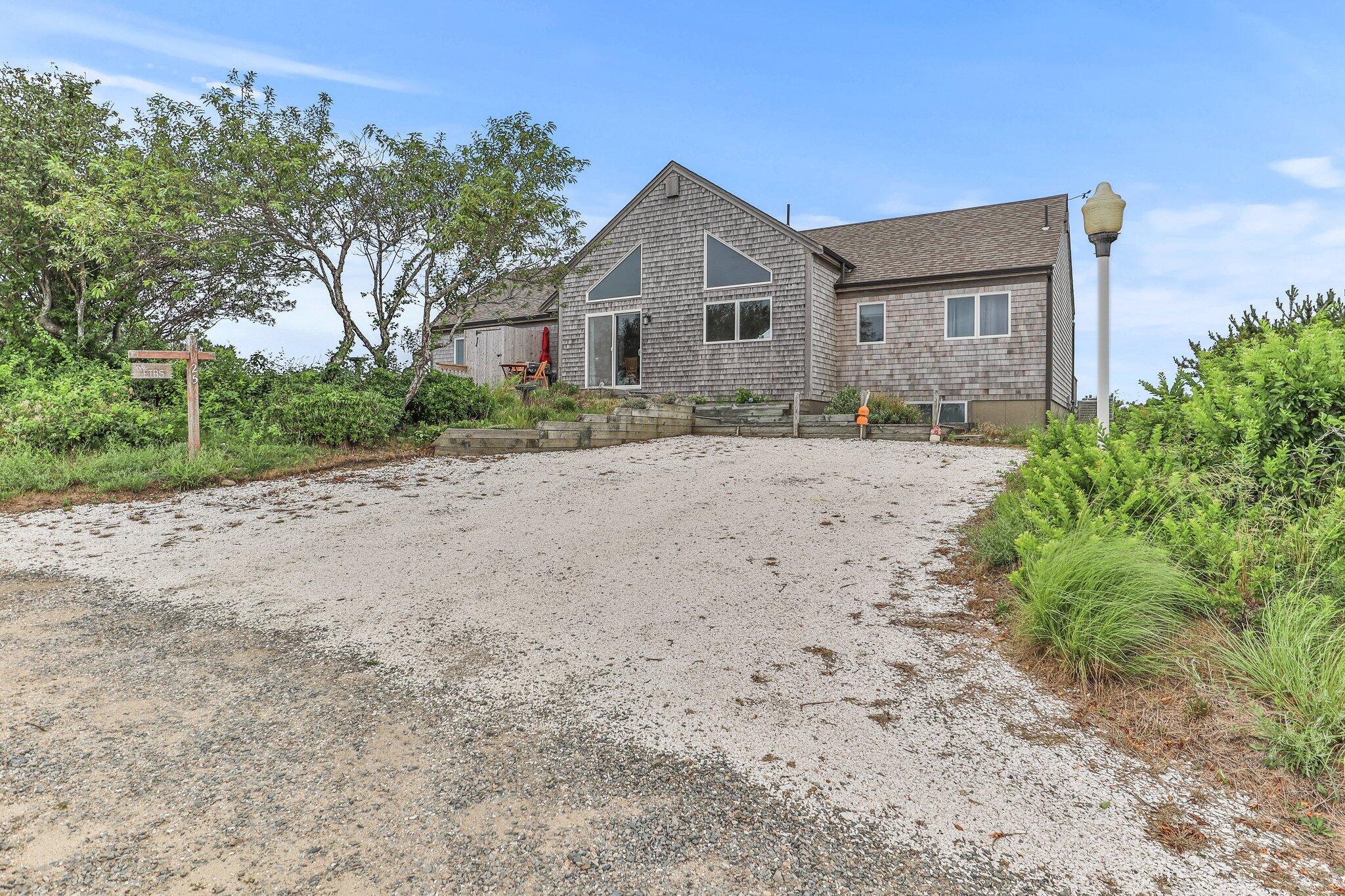25 Great Hills Road Truro, MA 02666 - Photo 45 of 68 a front view of a house with a yard