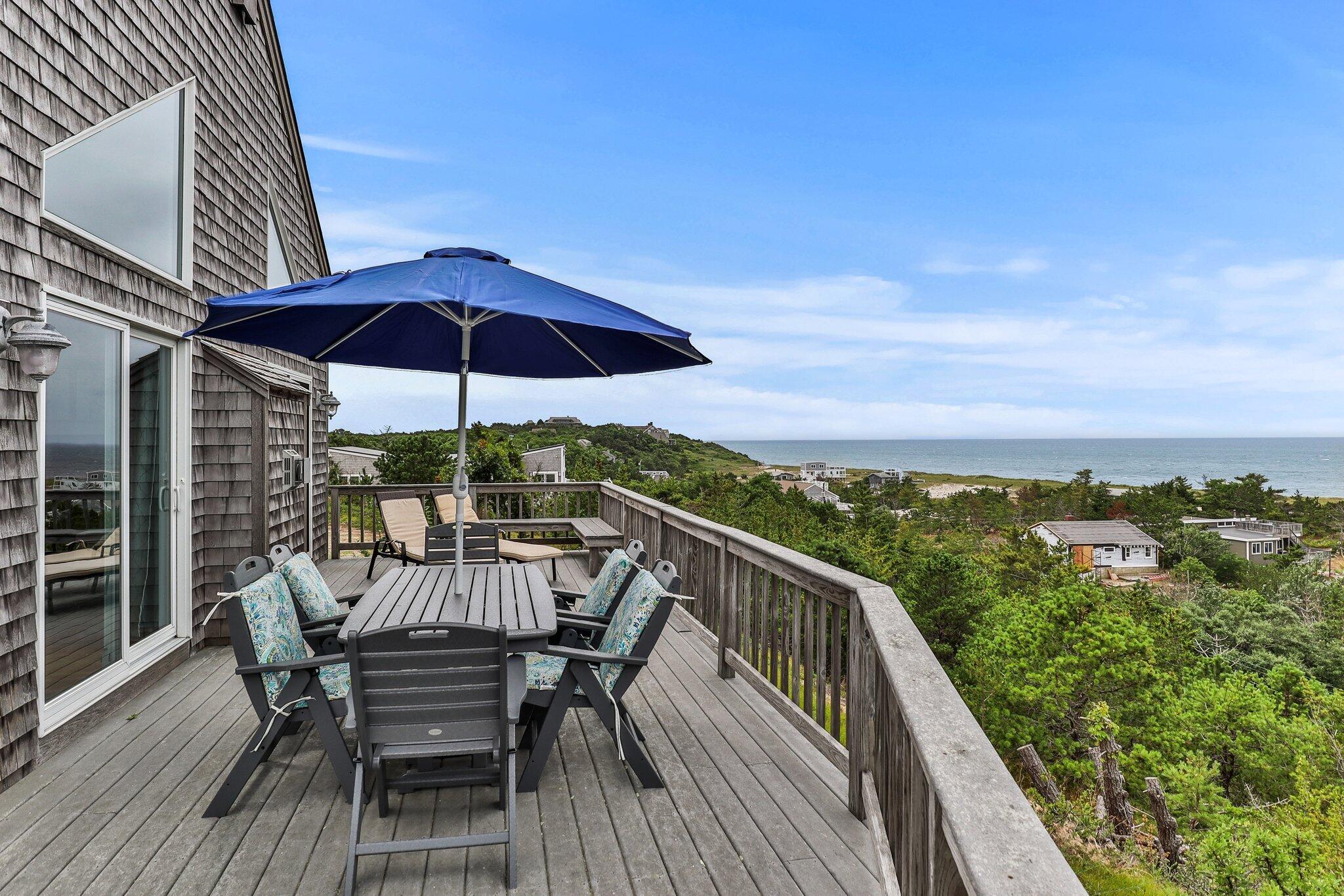 25 Great Hills Road Truro, MA 02666 - Photo 7 of 68 a view of a balcony with furniture and wooden floor