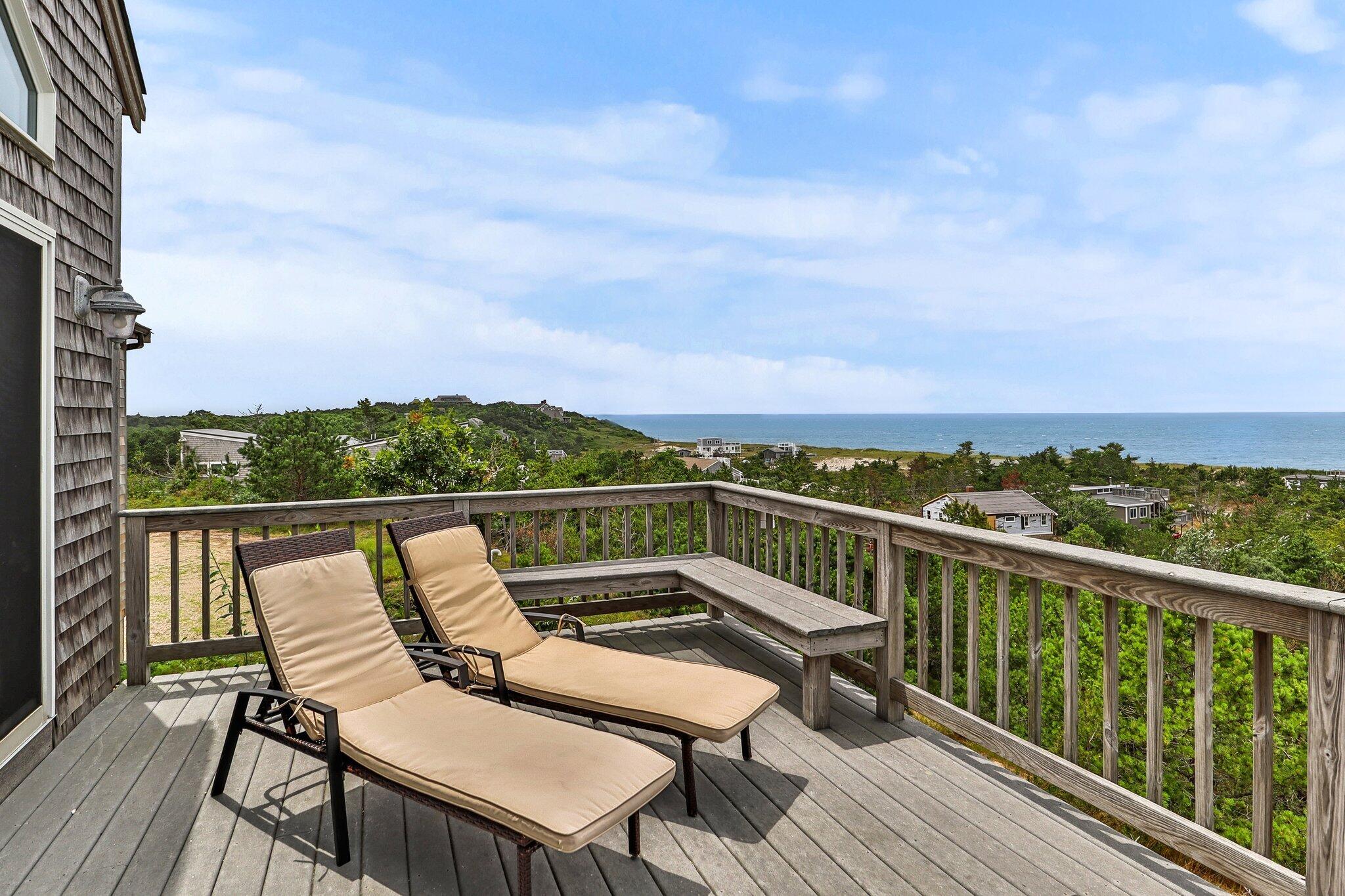 25 Great Hills Road Truro, MA 02666 - Photo 8 of 68 a view of a balcony with two chairs and a table