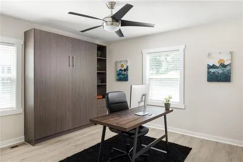 a workspace with furniture and a window