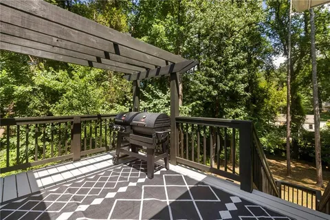 a view of balcony with wooden floor and outdoor seating