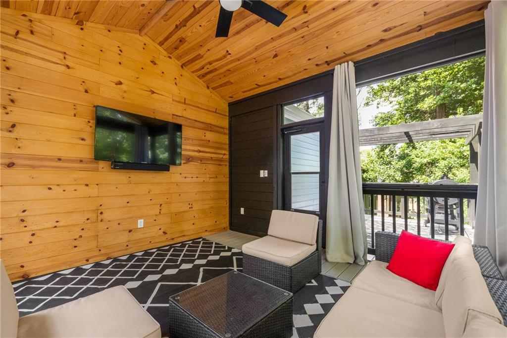 1675 Alvarado Terrace Southwest Atlanta, GA 30310 - Photo 2 of 26 a balcony with furniture and a flat screen tv