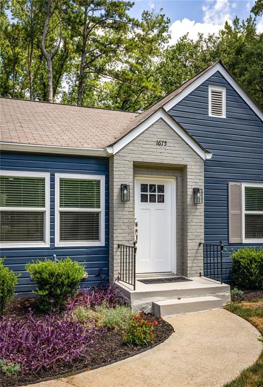 1675 Alvarado Terrace Southwest Atlanta, GA 30310 - Photo 24 of 26 a front view of a house with garden