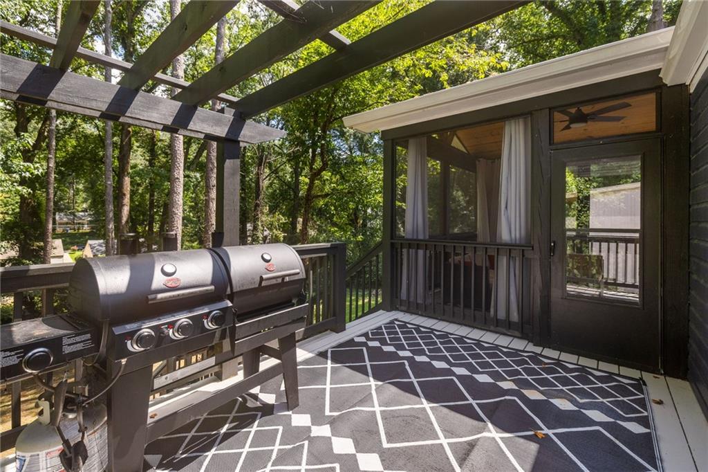1675 Alvarado Terrace Southwest Atlanta, GA 30310 - Photo 5 of 26 a view of a patio with a dining table and chairs with wooden floor