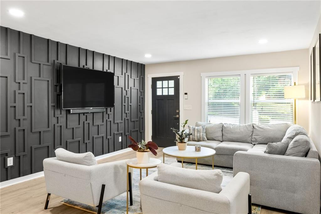 1675 Alvarado Terrace Southwest Atlanta, GA 30310 - Photo 6 of 26 a living room with furniture and a flat screen tv