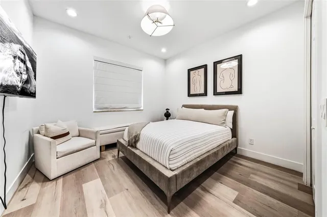 a bedroom with bed and a couch