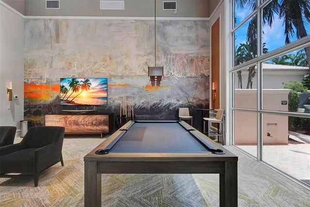 a room with furniture and a flat screen tv