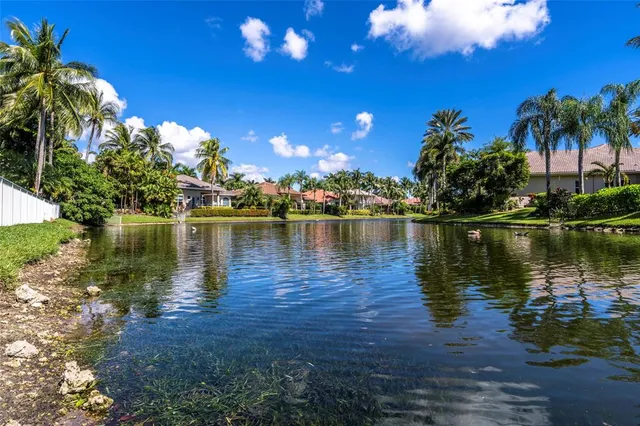 a view of a lake with a building in the background