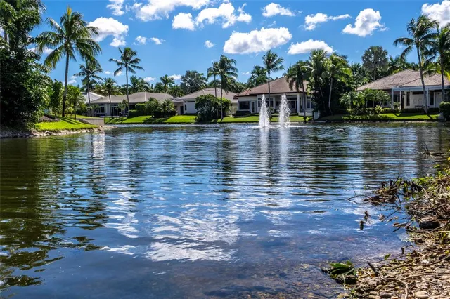 a view of swimming pool with outdoor seating and yard