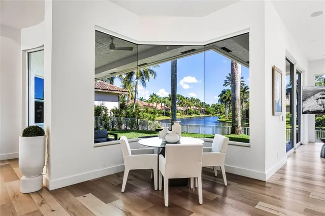 a dining room with furniture and window