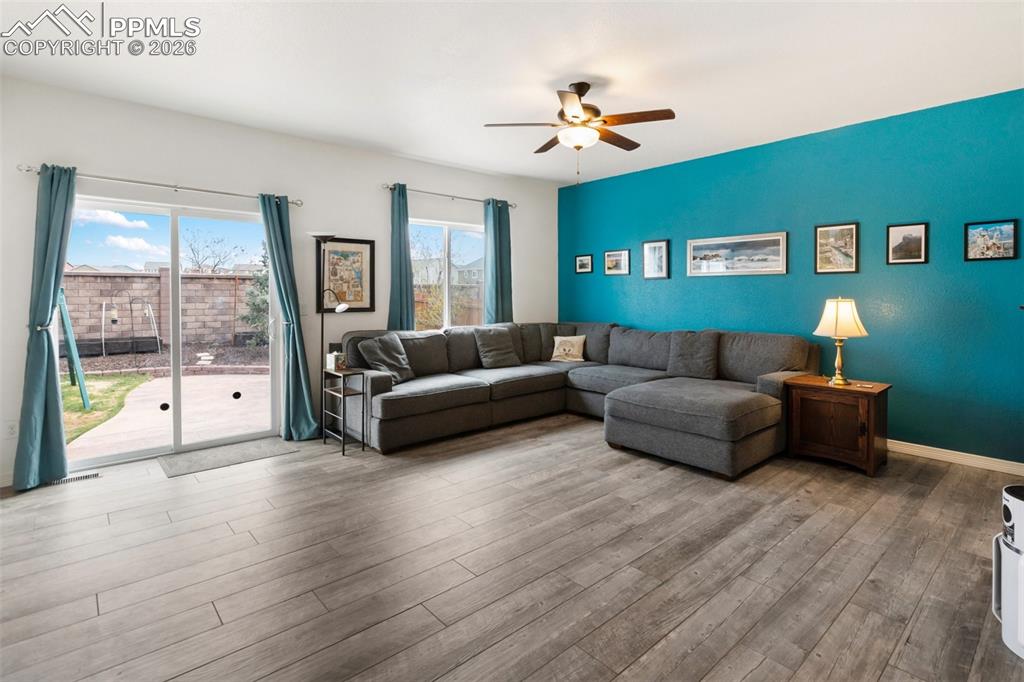 8458 Chasewood Loop Colorado Springs, CO 80908 - Photo 2 of 34 a living room with furniture and a large window