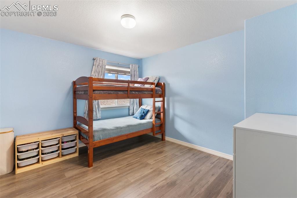 8458 Chasewood Loop Colorado Springs, CO 80908 - Photo 23 of 34 a bedroom with bunk bed