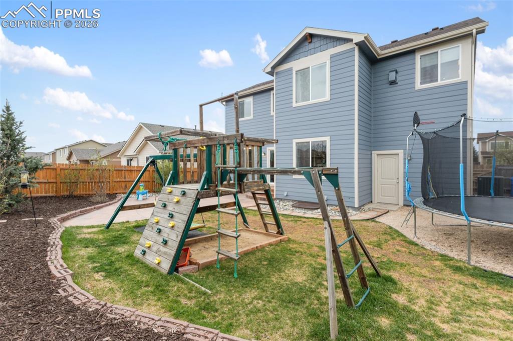 8458 Chasewood Loop Colorado Springs, CO 80908 - Photo 33 of 34 a view of a house with swimming pool