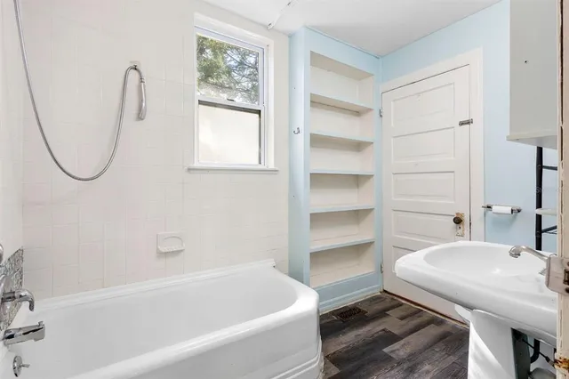 a bathroom with a sink a toilet and a bathtub