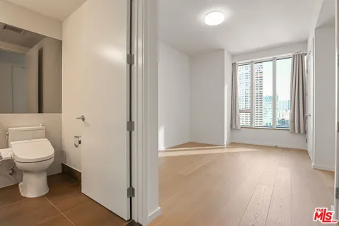 a bathroom with a toilet sink and tub