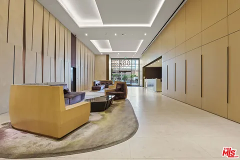 a living room with couches and a flat screen tv