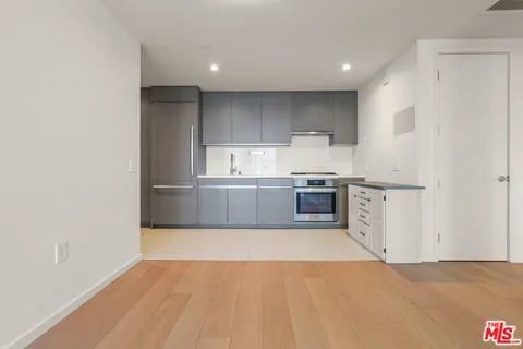 a view of kitchen with wooden floor