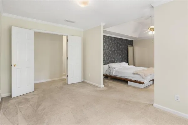 a bedroom with a bed and a cabinets