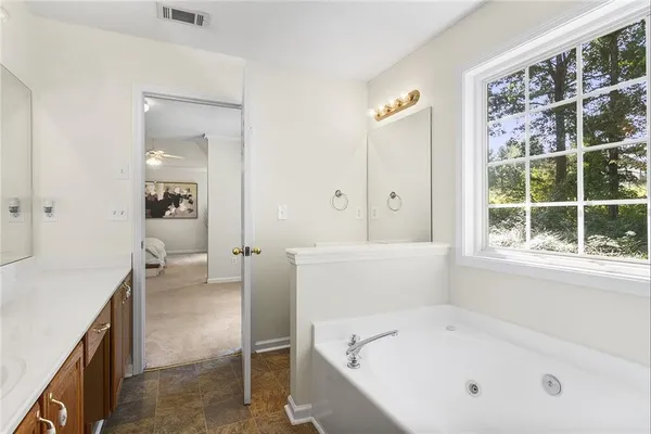 a bathroom with a bathtub and a sink