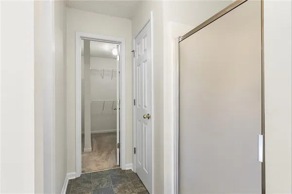 a view of a bathroom from the hallway
