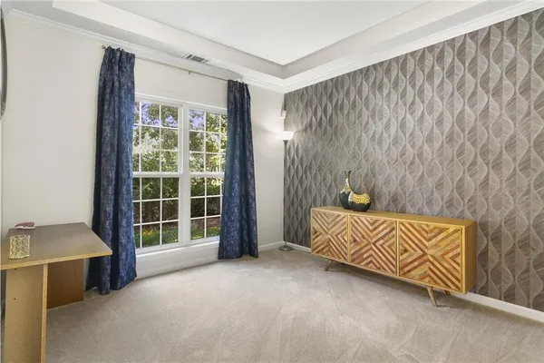 a bed room with a bed and a window