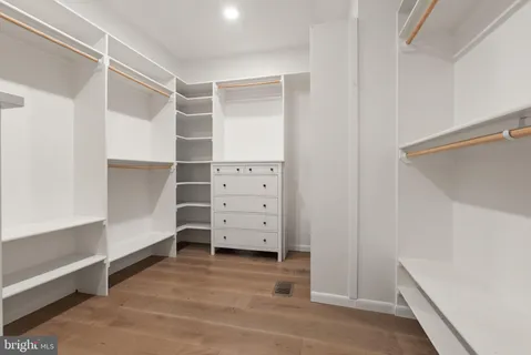 a bathroom with a toilet a sink and a mirror